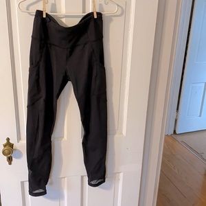 Lululemon black leggings with mesh inserts and side pockets